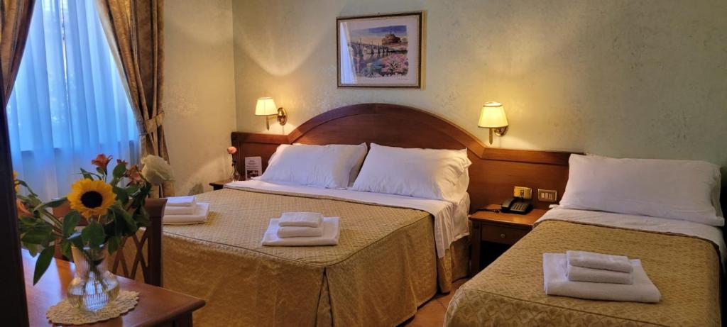 Letto o letti in una camera di Hotel Squarciarelli