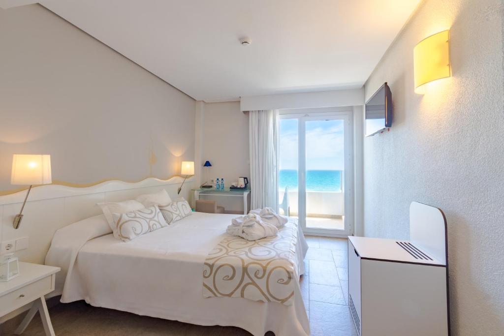 Postel nebo postele na pokoji v ubytování Hotel Meridional