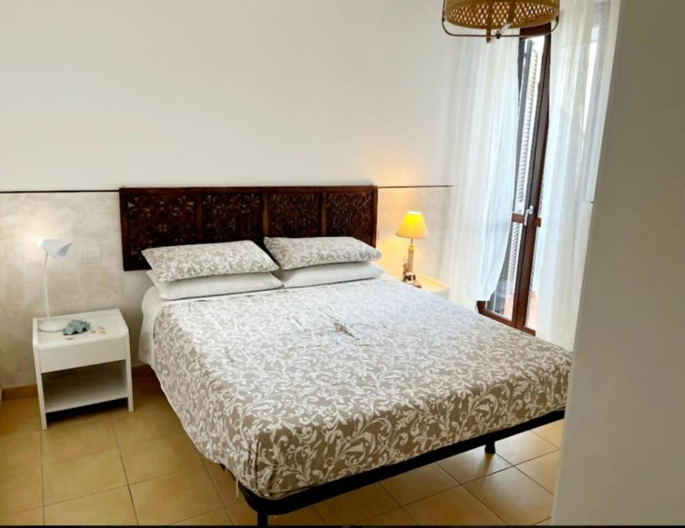 En eller flere senge i et værelse på Athena - Casa Casoni