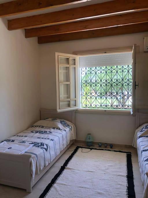 Postel nebo postele na pokoji v ubytování Dar al Murad : Une maison, un coin de paradis