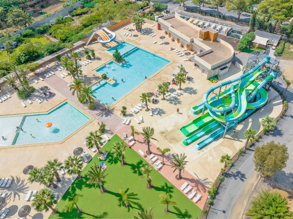 an overhead view of a water park with two pools at Camping Le Barcarès in Le Barcarès