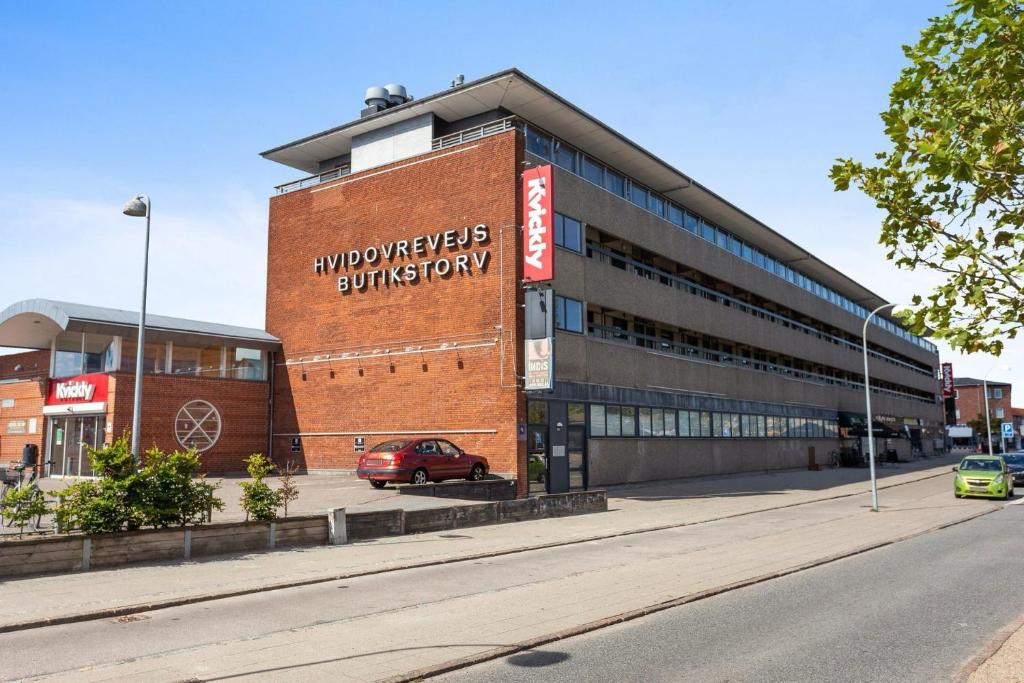 a building with a sign on the side of it at VS-Guesthouse in Copenhagen