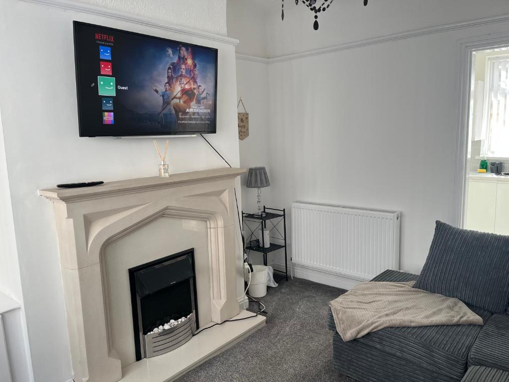 A television and/or entertainment centre at 2 Bed Property with parking