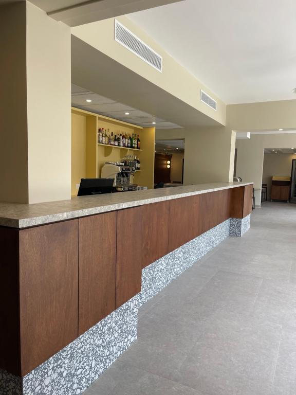 a lobby of a hospital with a reception counter at Hotel des Victoires - Restaurant in Cannes