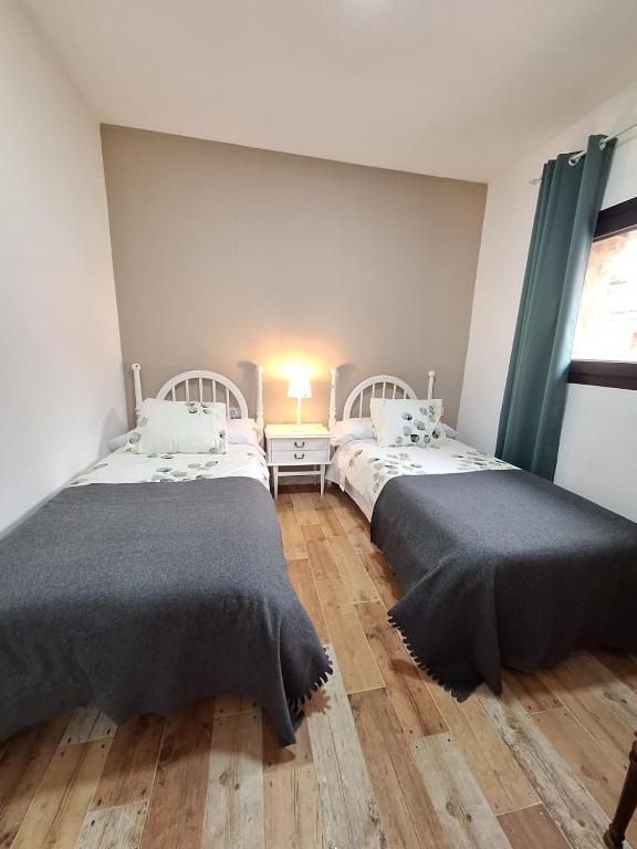 Łóżko lub łóżka w pokoju w obiekcie Casas Rurales Los Marqueses