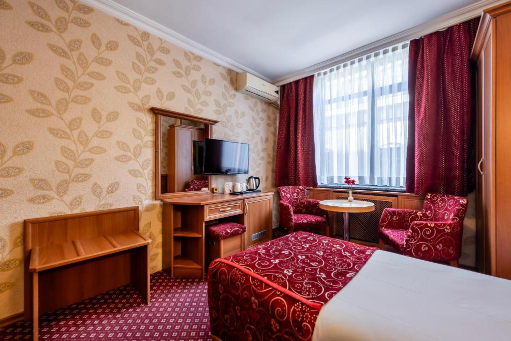 Postel nebo postele na pokoji v ubytování Hotel Bristol