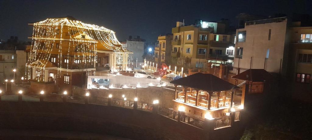 a view of a city at night with lights at Manaslu Homestay in Kathmandu