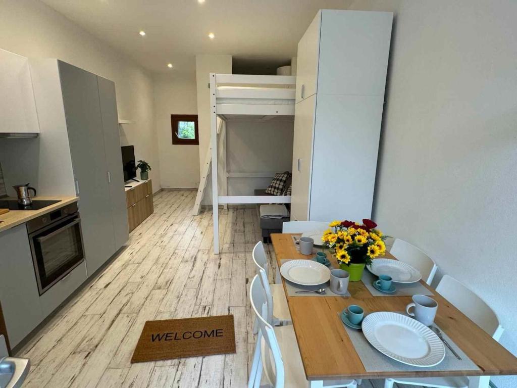 a kitchen and dining room with a table and chairs at Casa Bruno in Marciana