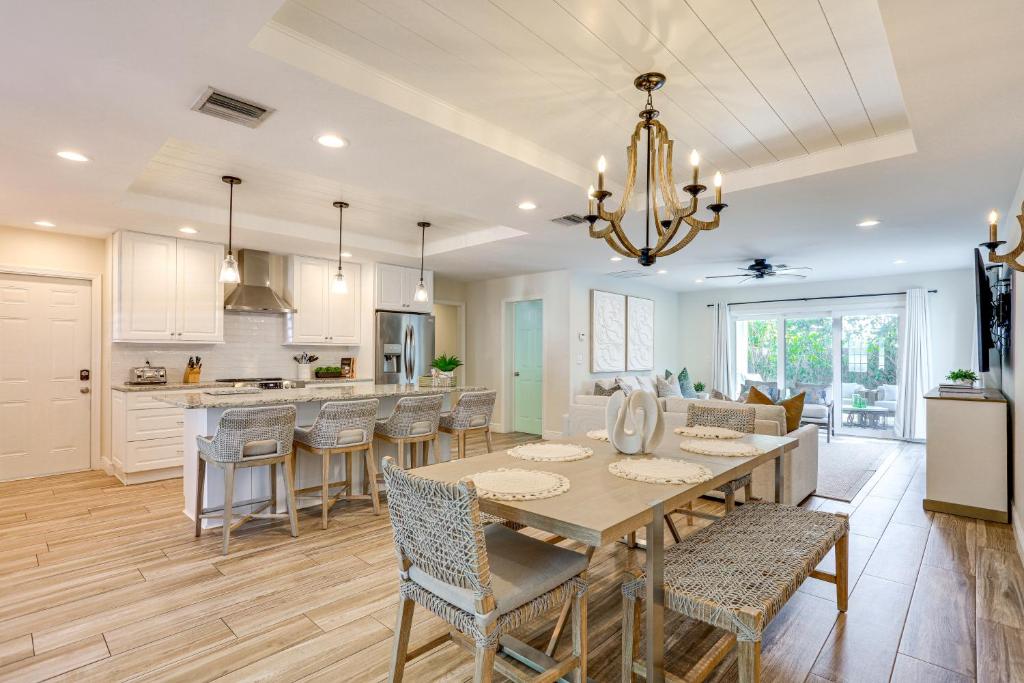 a kitchen and dining room with a table and chairs at Pet-Friendly Retreat in Stuart with Saltwater Pool! in Stuart