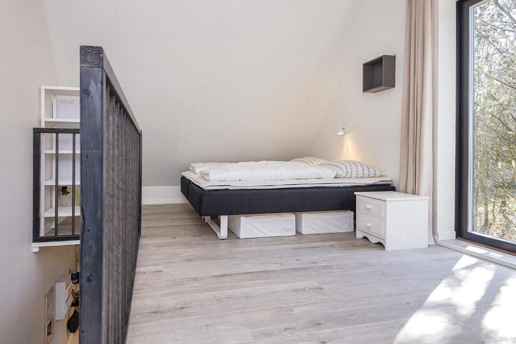 Postel nebo postele na pokoji v ubytování Holiday home Hovborg XIV