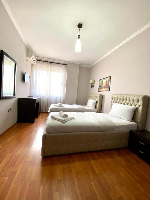 Postel nebo postele na pokoji v ubytování Prince Hotel