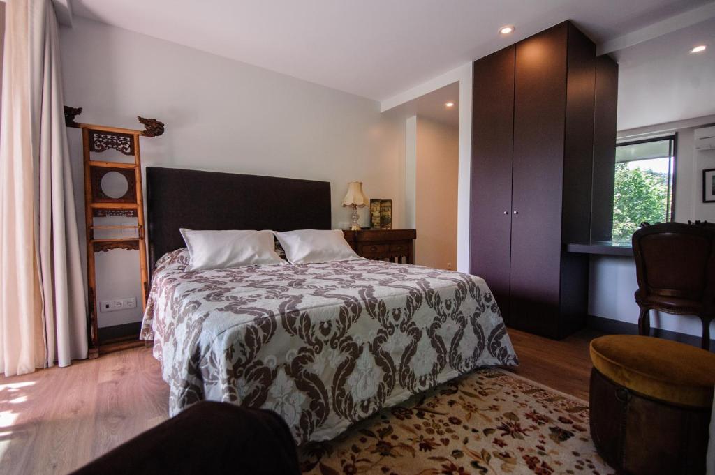 Postel nebo postele na pokoji v ubytování Quinta dos Carqueijais Resort & Wellness Gerês