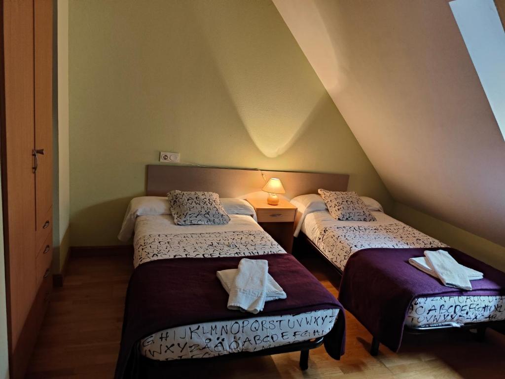 Ένα ή περισσότερα κρεβάτια σε δωμάτιο στο Apartamento Aran isaba
