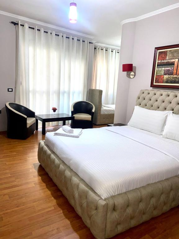Postel nebo postele na pokoji v ubytování Prince Hotel
