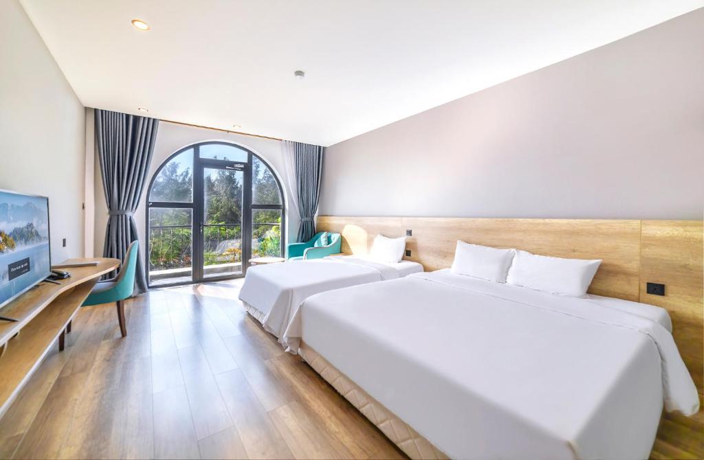 Postel nebo postele na pokoji v ubytování Hafi Beach Hotel