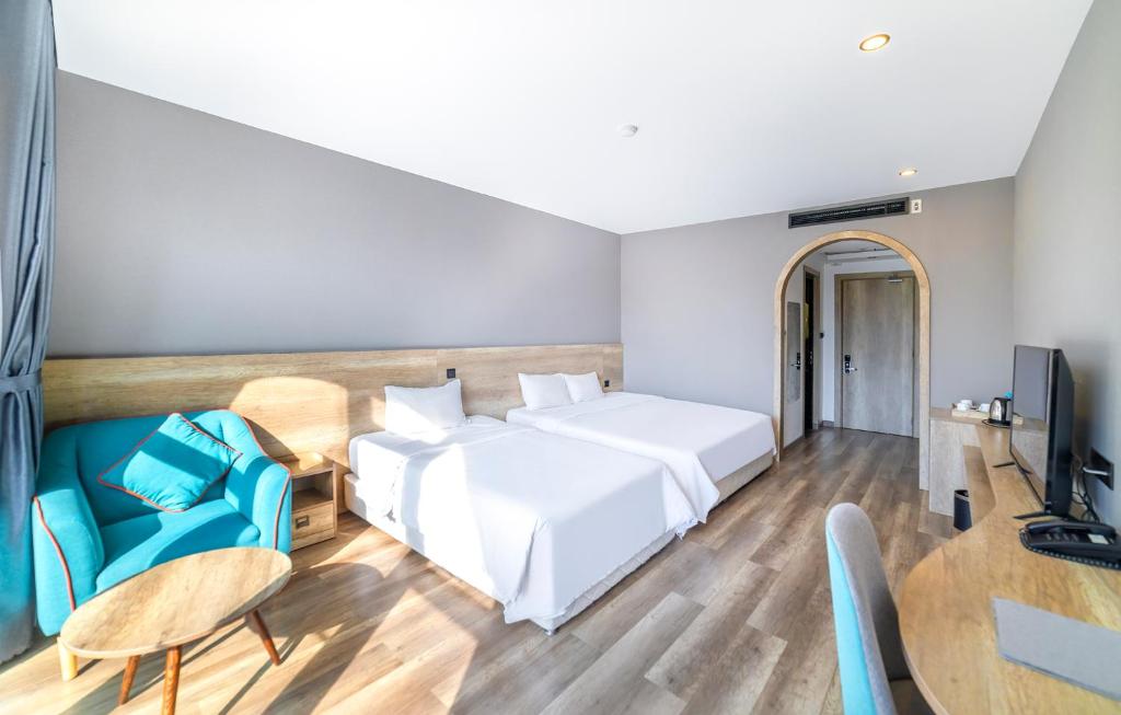 Postel nebo postele na pokoji v ubytování Hafi Beach Hotel