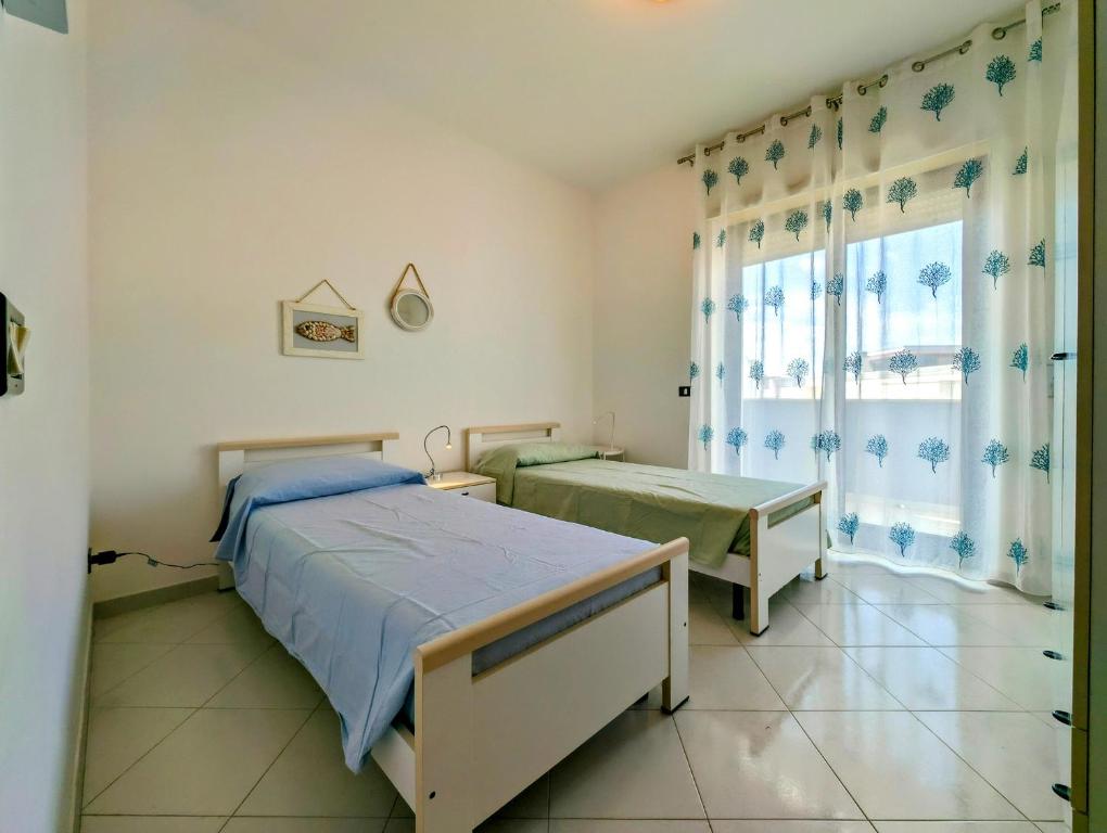 Posteľ alebo postele v izbe v ubytovaní Oikia Vacanze Otranto Teto