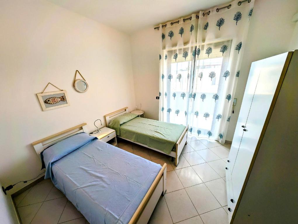 Posteľ alebo postele v izbe v ubytovaní Oikia Vacanze Otranto Teto