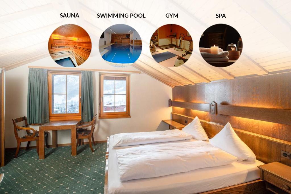 ein Hotelzimmer mit einem Bett und einem Schreibtisch in der Unterkunft Grichting Hotel & Serviced Apartments in Leukerbad