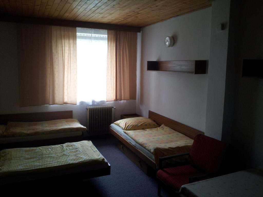 Postel nebo postele na pokoji v ubytování Penzion Tenis