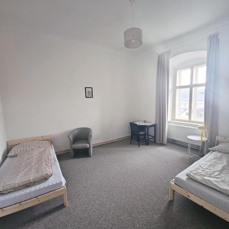 Łóżko lub łóżka w pokoju w obiekcie Zámek Ruda nad Moravou