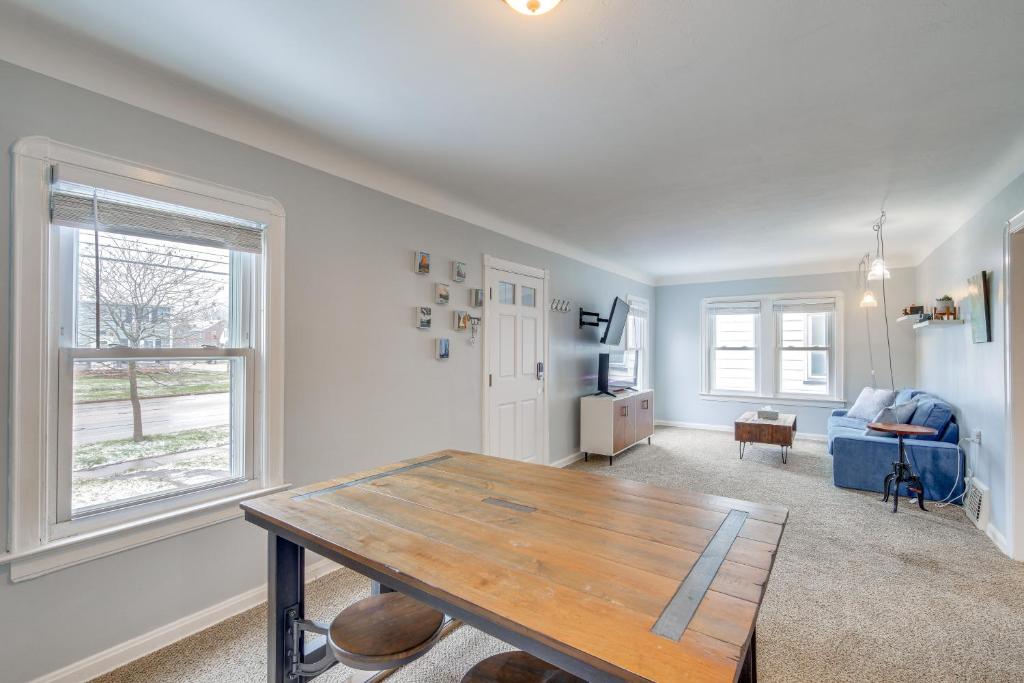 a living room with a table and a couch at Convenient Cleveland Abode with Office and Home Gym in Cleveland