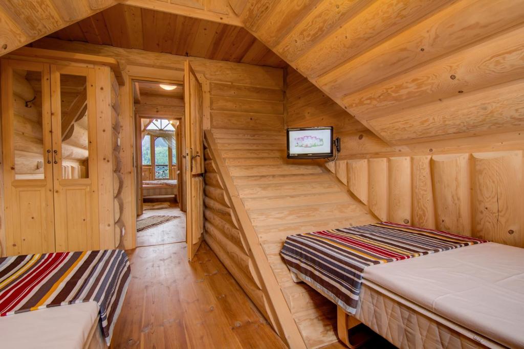 Posteľ alebo postele v izbe v ubytovaní Domki Tatra Lux Zakopane