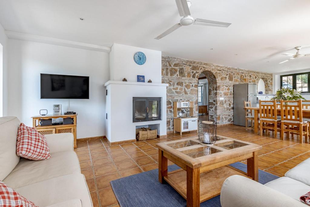 a living room with a couch and a table at Padre Aviles in Olías