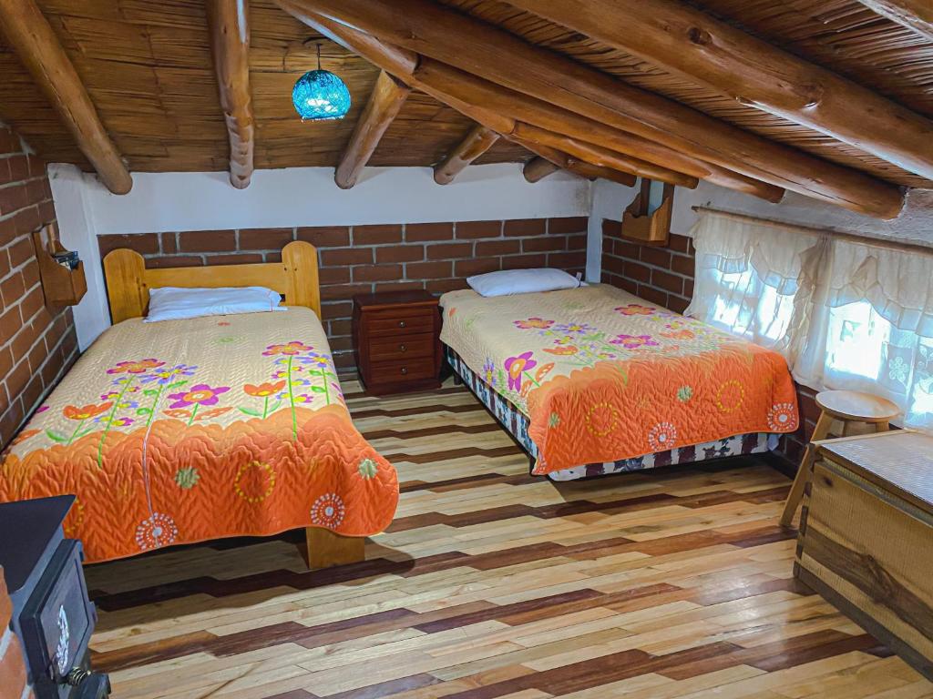Postel nebo postele na pokoji v ubytování Hostería Chukirawa