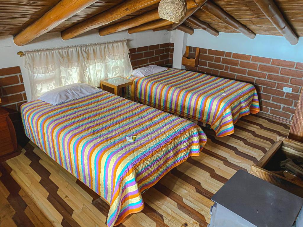 Postel nebo postele na pokoji v ubytování Hostería Chukirawa