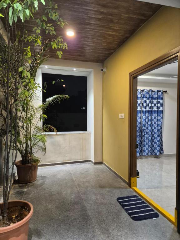 an open door to a room with a window at Swayamkrushi 2nd Floor in Hyderabad