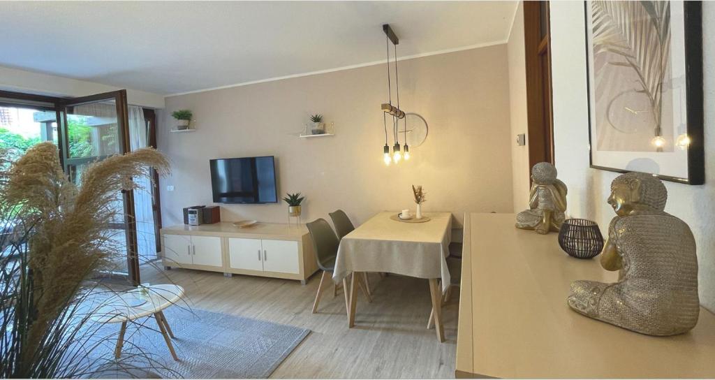 a living room with a table and a dining room at Apartment Gerberbachviertel in Weinheim