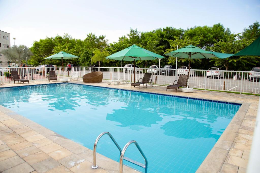 Swimmingpoolen hos eller tæt på Apartamento Aconchego beach
