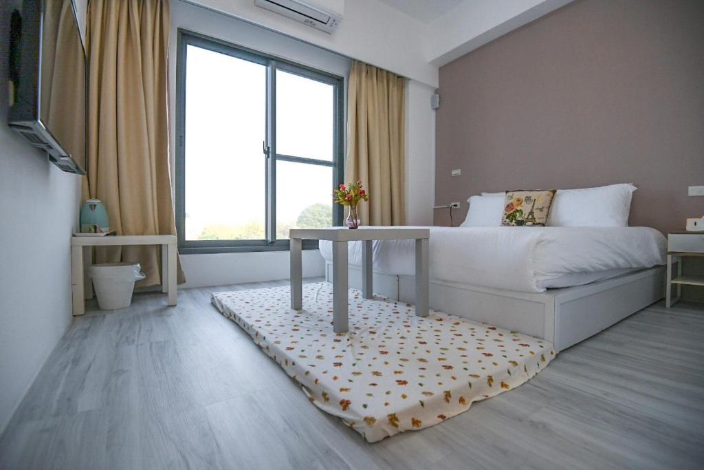 Postel nebo postele na pokoji v ubytování Love米渡假會館