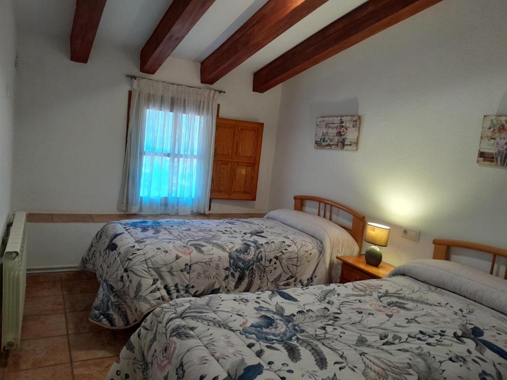 Postel nebo postele na pokoji v ubytování Casa Manolita