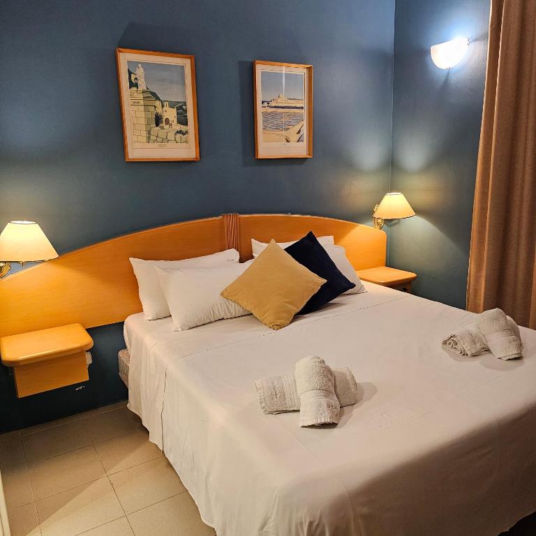 Postel nebo postele na pokoji v ubytování La Playa Hotel