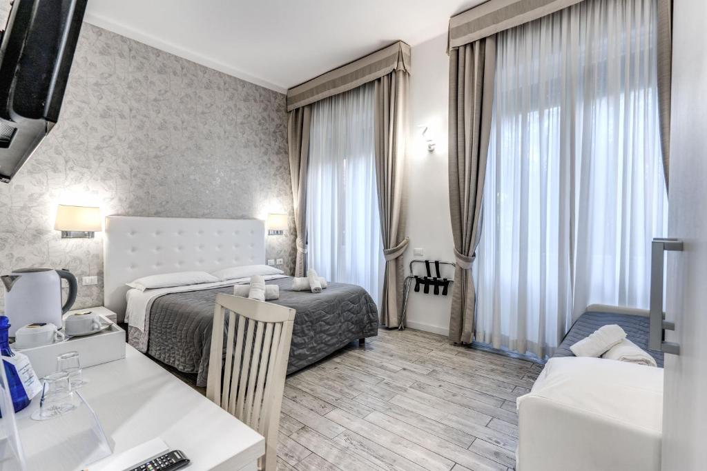 A bed or beds in a room at Gardenia Suite