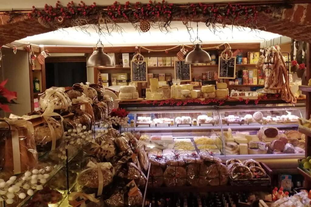 a store filled with lots of food on display at La Grangia in Giaveno