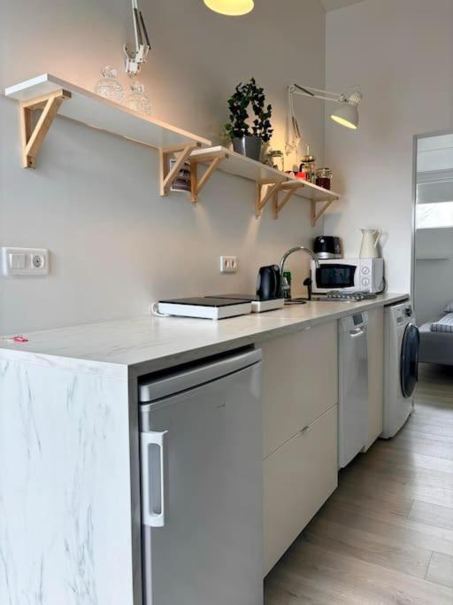 a kitchen with a white counter top in a room at Selfoss Center apartment in Selfoss