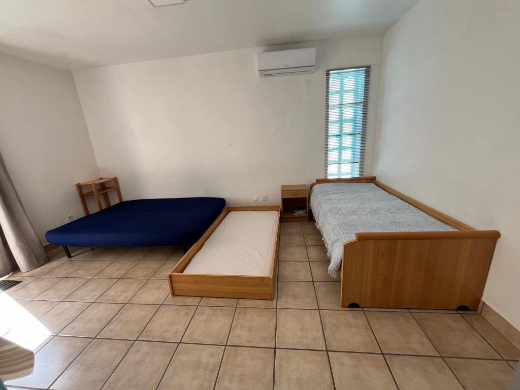 Posteľ alebo postele v izbe v ubytovaní Barcarès Beach Rental
