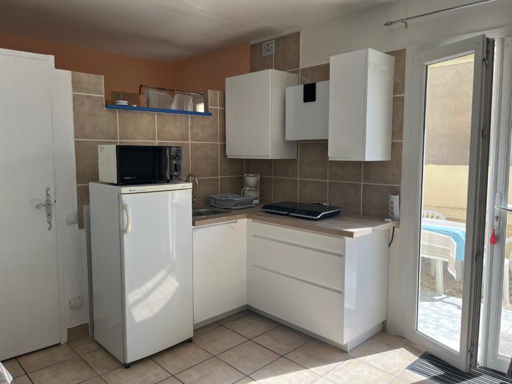 Kuchyňa alebo kuchynka v ubytovaní Barcarès Beach Rental