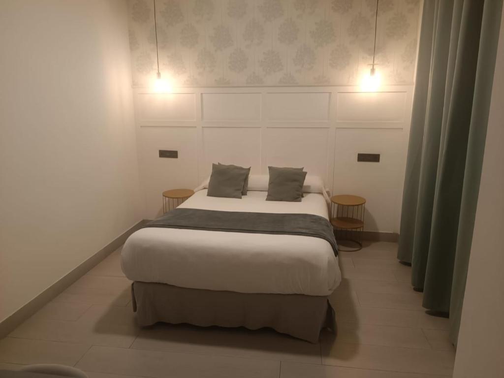 Postel nebo postele na pokoji v ubytování Hotel Cedran