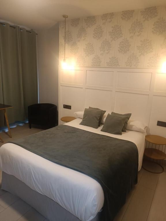 Postel nebo postele na pokoji v ubytování Hotel Cedran