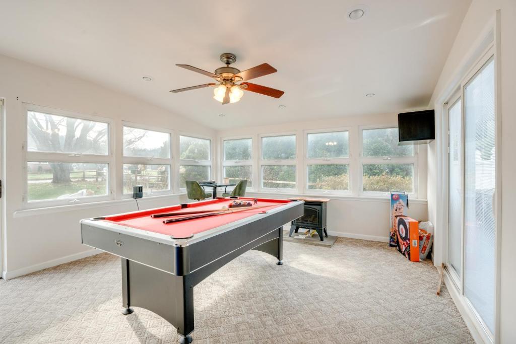 a pool table in a room with windows at Coopersburg Vacation Rental with Outdoor Oasis! in Coopersburg