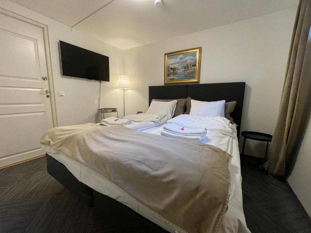 Postel nebo postele na pokoji v ubytování Vid Gekås Ullared Boende B&B