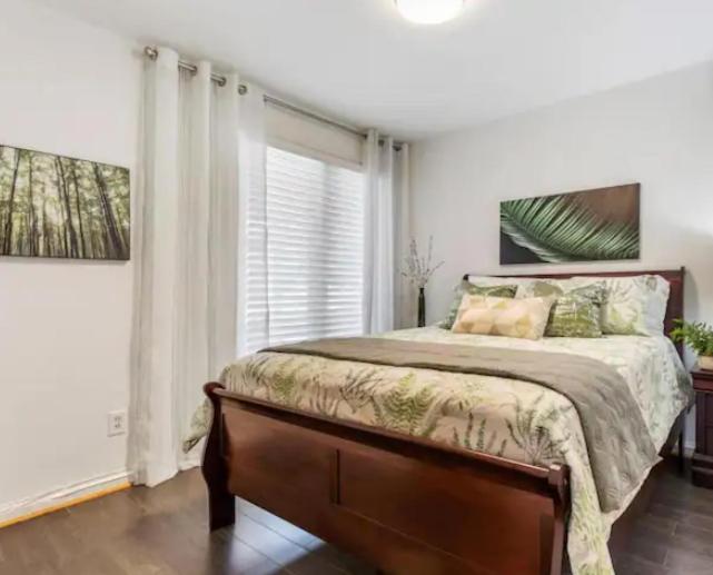 a bedroom with a large bed and a window at Vihome3001C1-3-Bedrooms facing park and school in Toronto