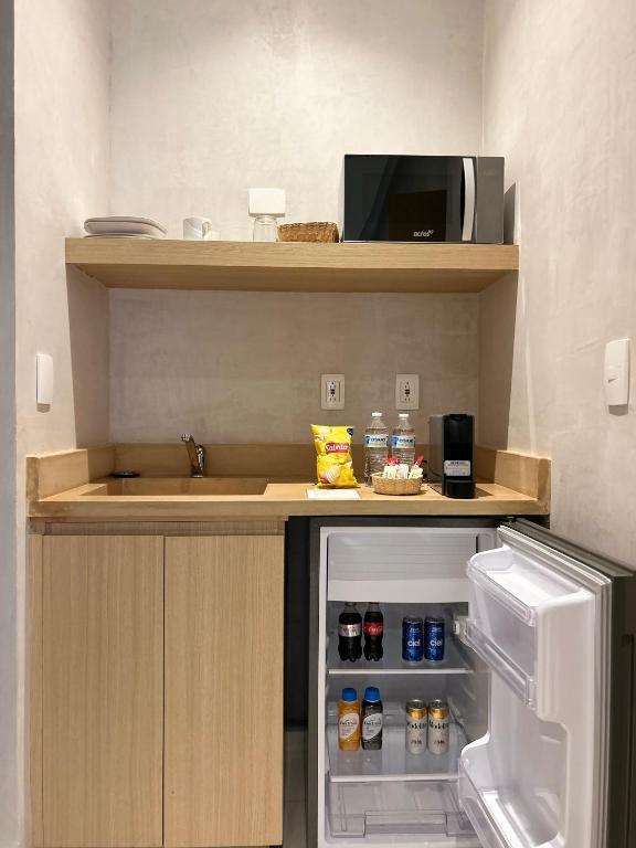 Una cocina o zona de cocina en Casa Quiote Hotel Boutique City Center based - Adults Only