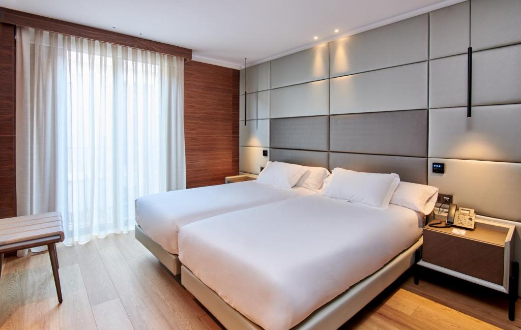 Postel nebo postele na pokoji v ubytování Hotel MyPalace León