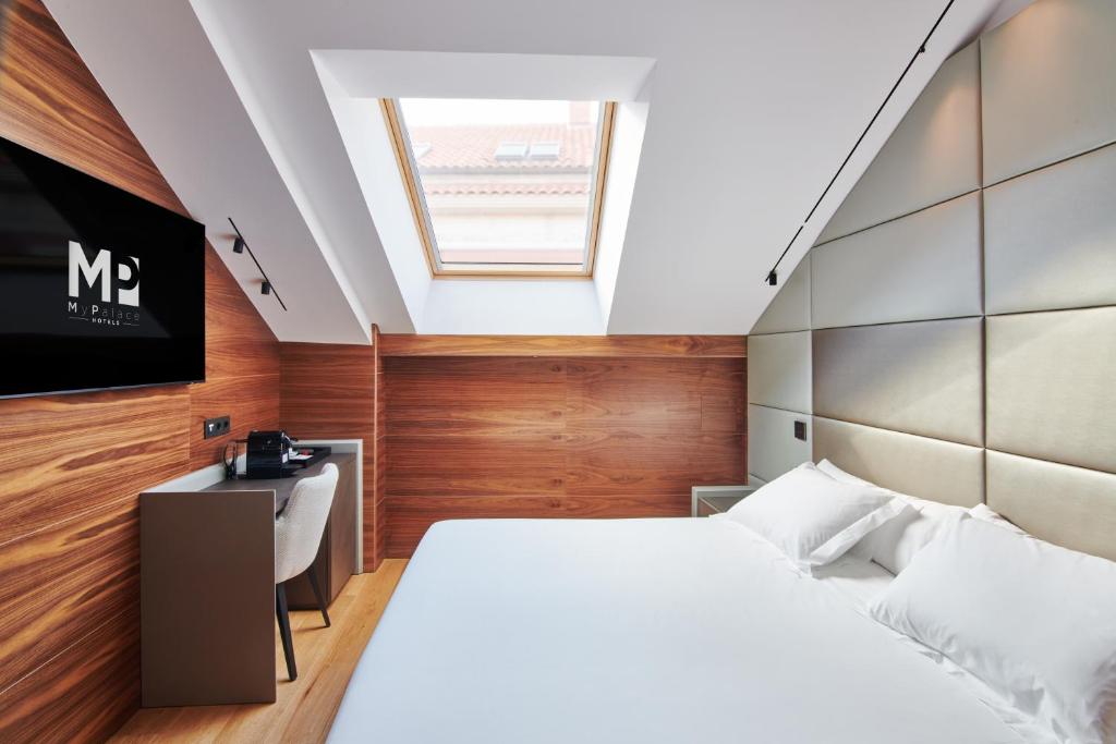 Postel nebo postele na pokoji v ubytování Hotel MyPalace León