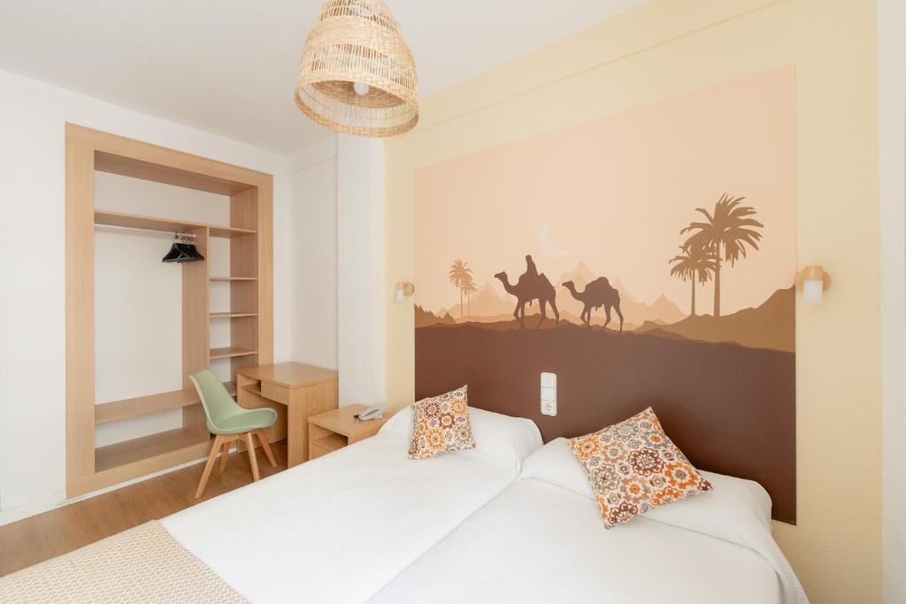 Postel nebo postele na pokoji v ubytování Hotel Internacional
